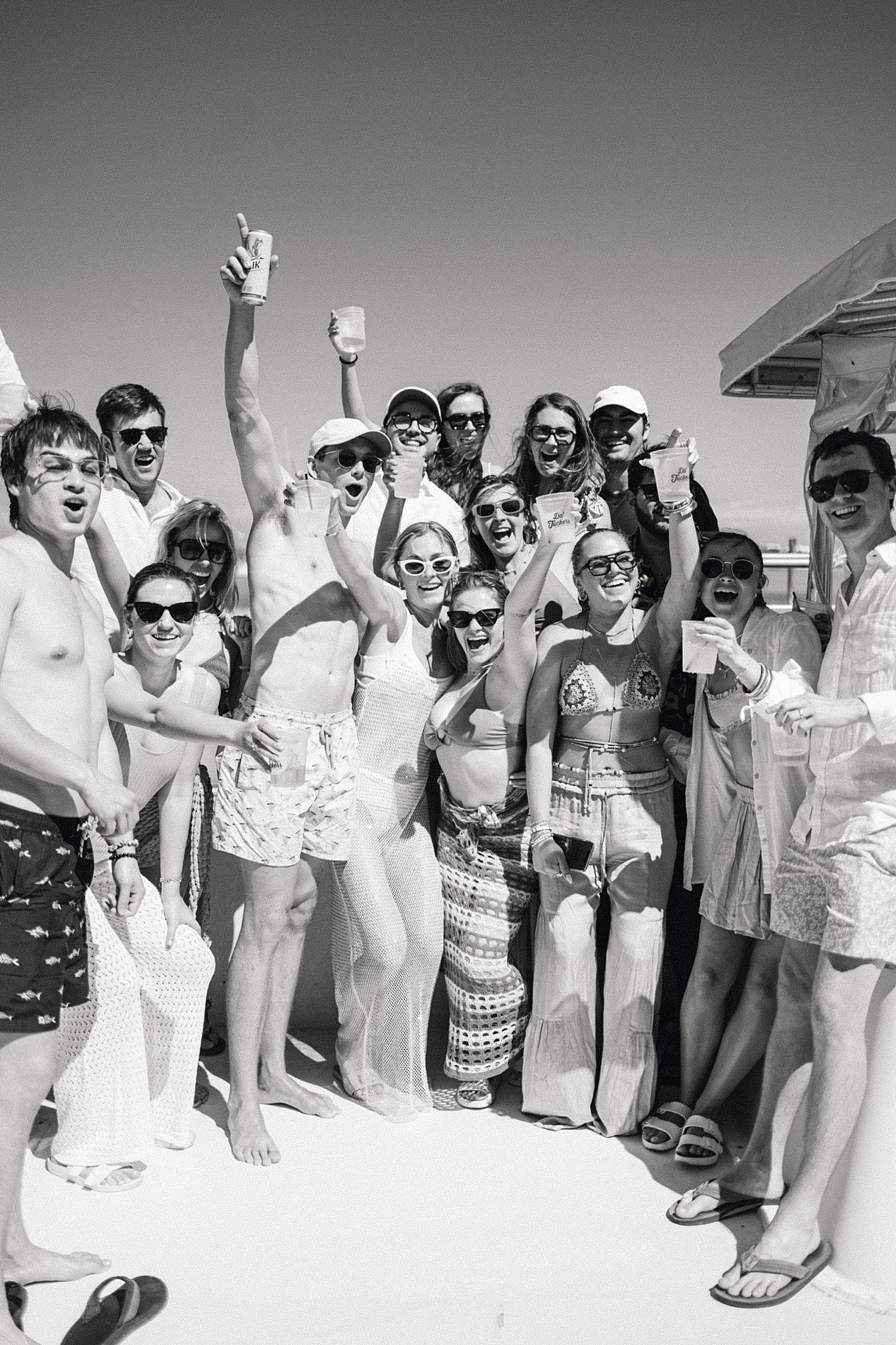 Group of friends with bride & groom on boat