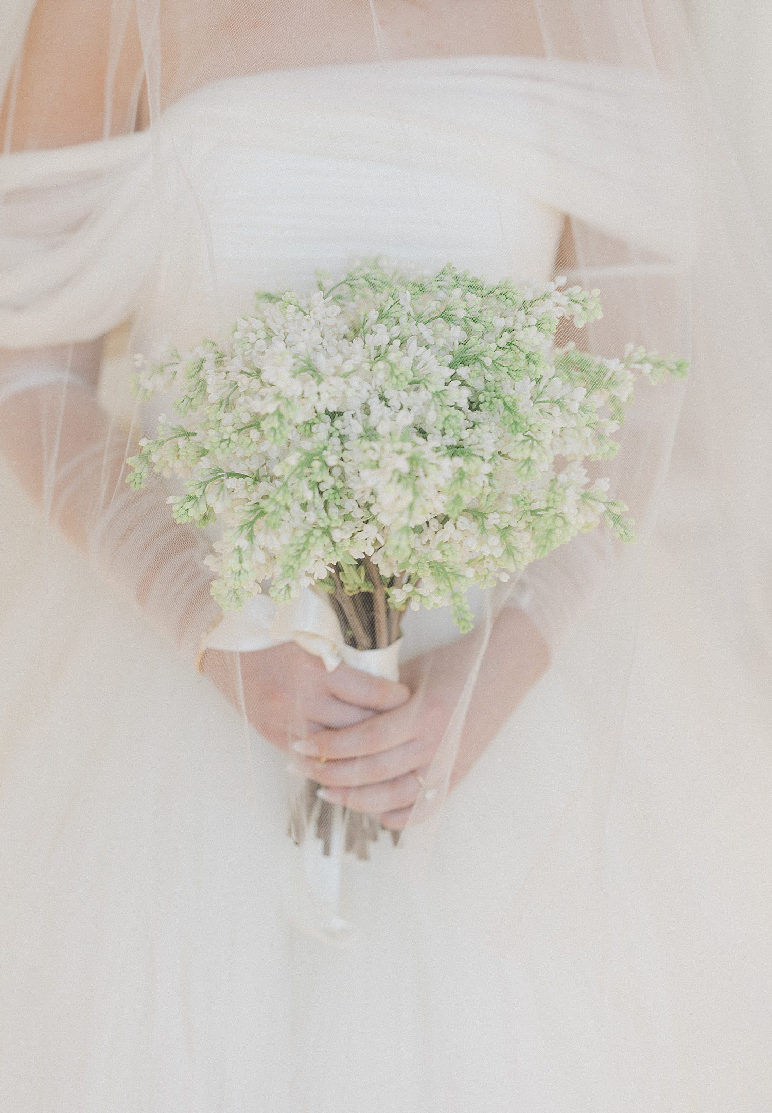 Close up of bride's white floral bouquet at Creative Chateau in Houston