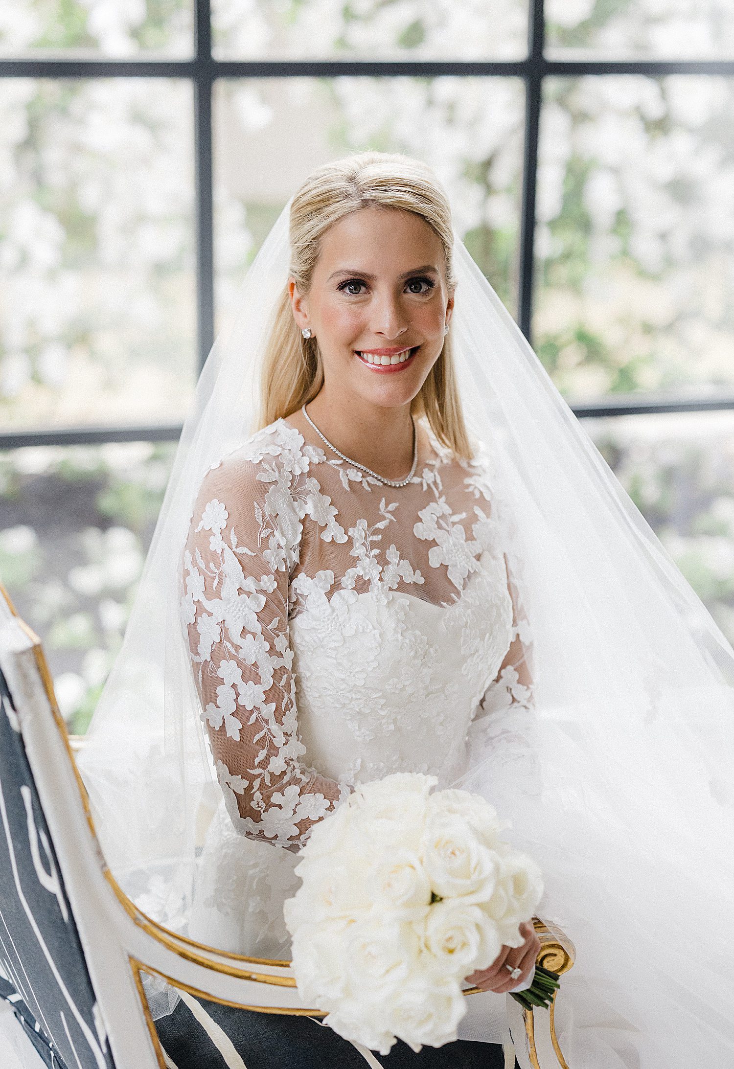 Bride holding bouquet during bridal photoshoot at home in Houston