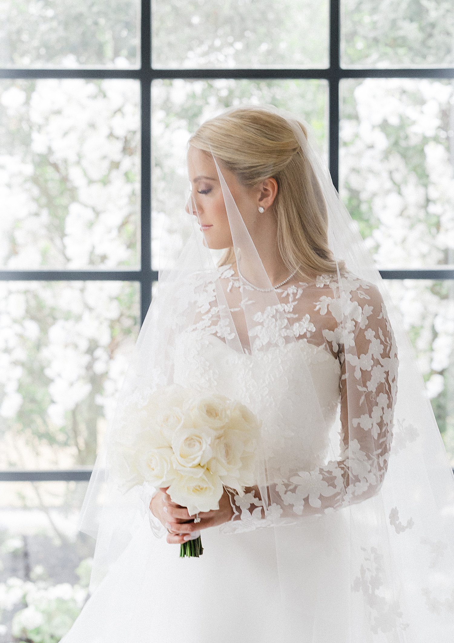 Bride holding bouquet during bridal photoshoot at home in Houston