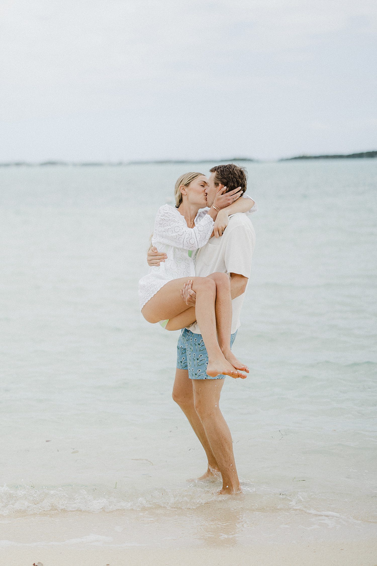 couple kissing on beach in the Bahamas