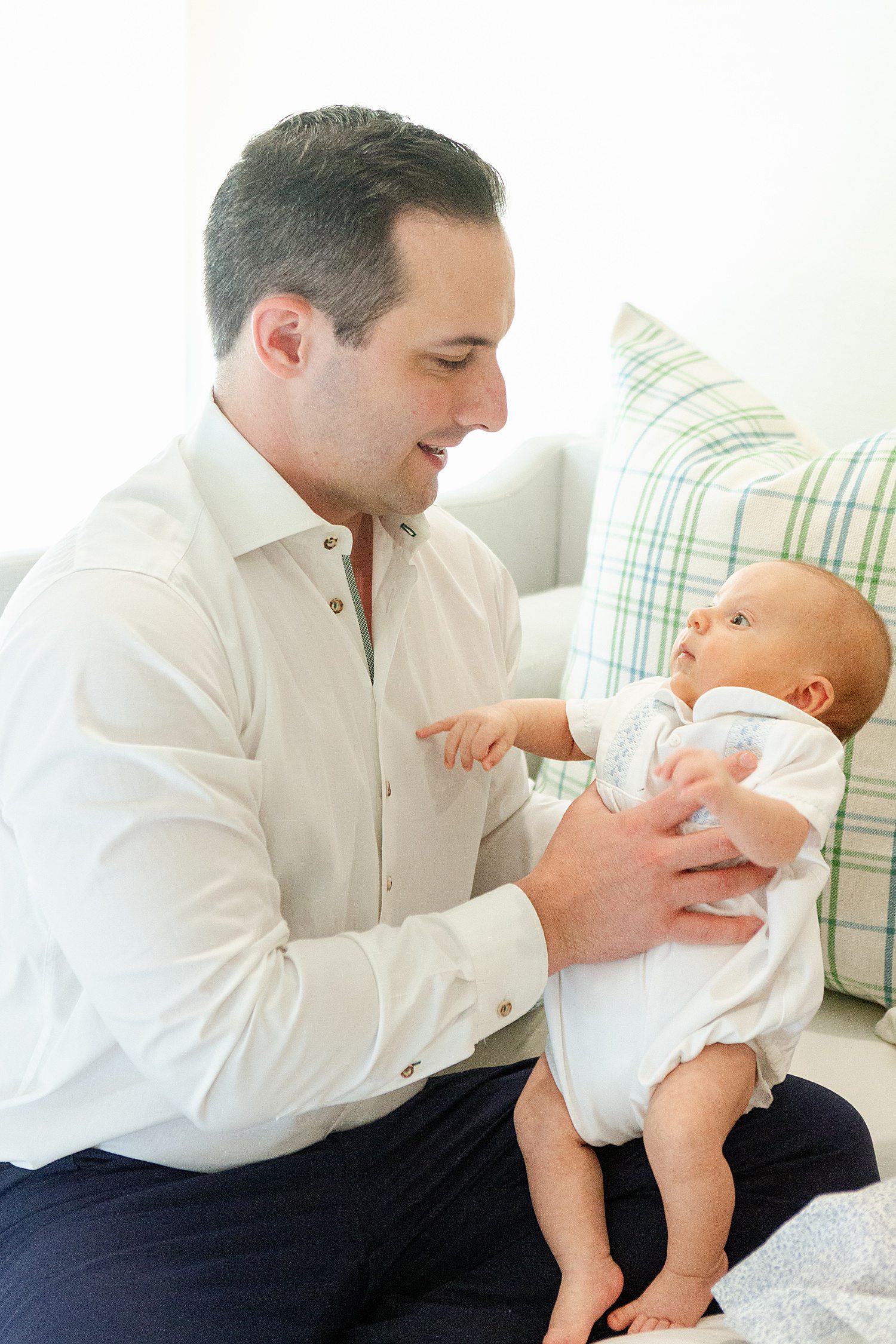 Dad holding newborn son