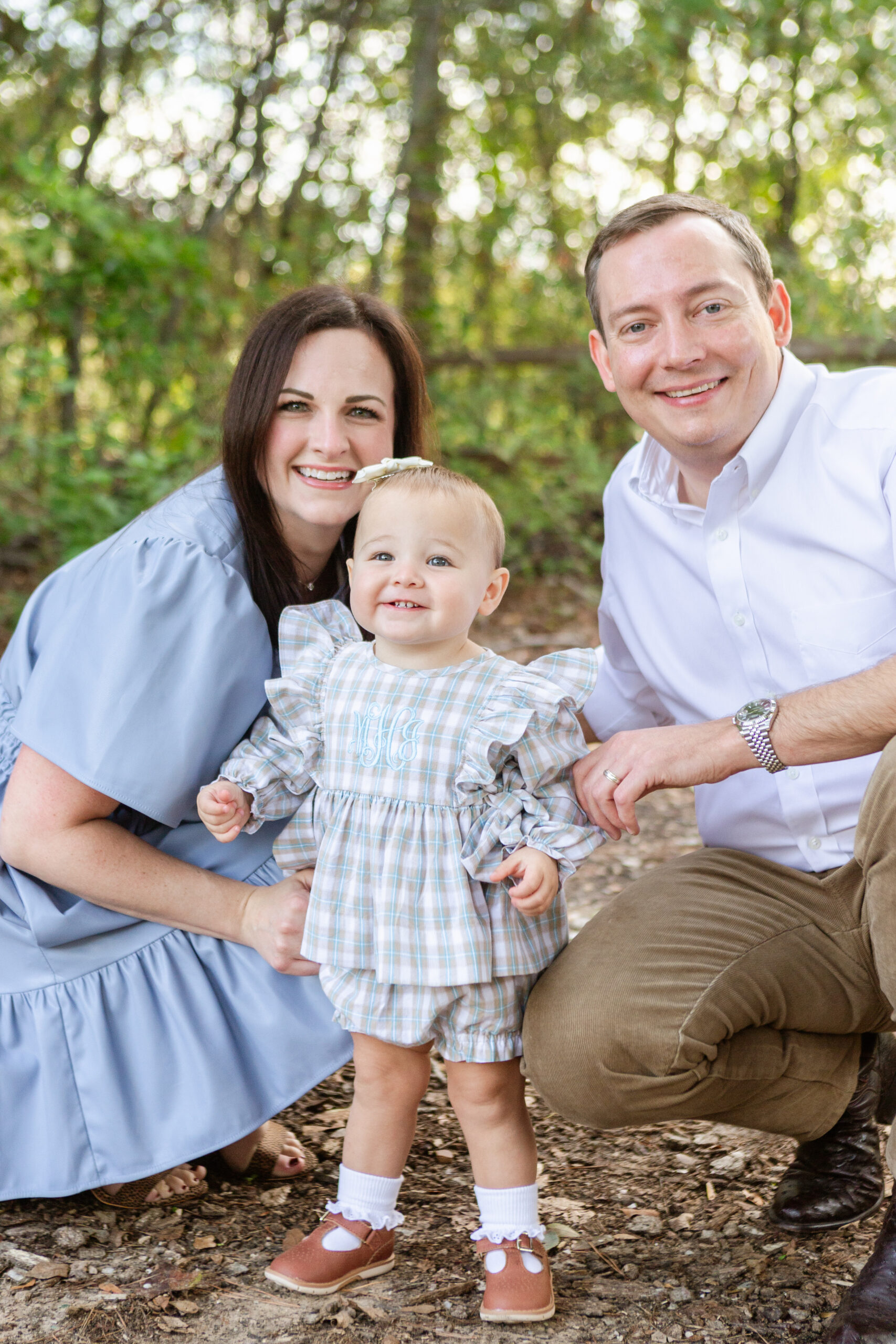 family photo with mom, dad, and baby daughter