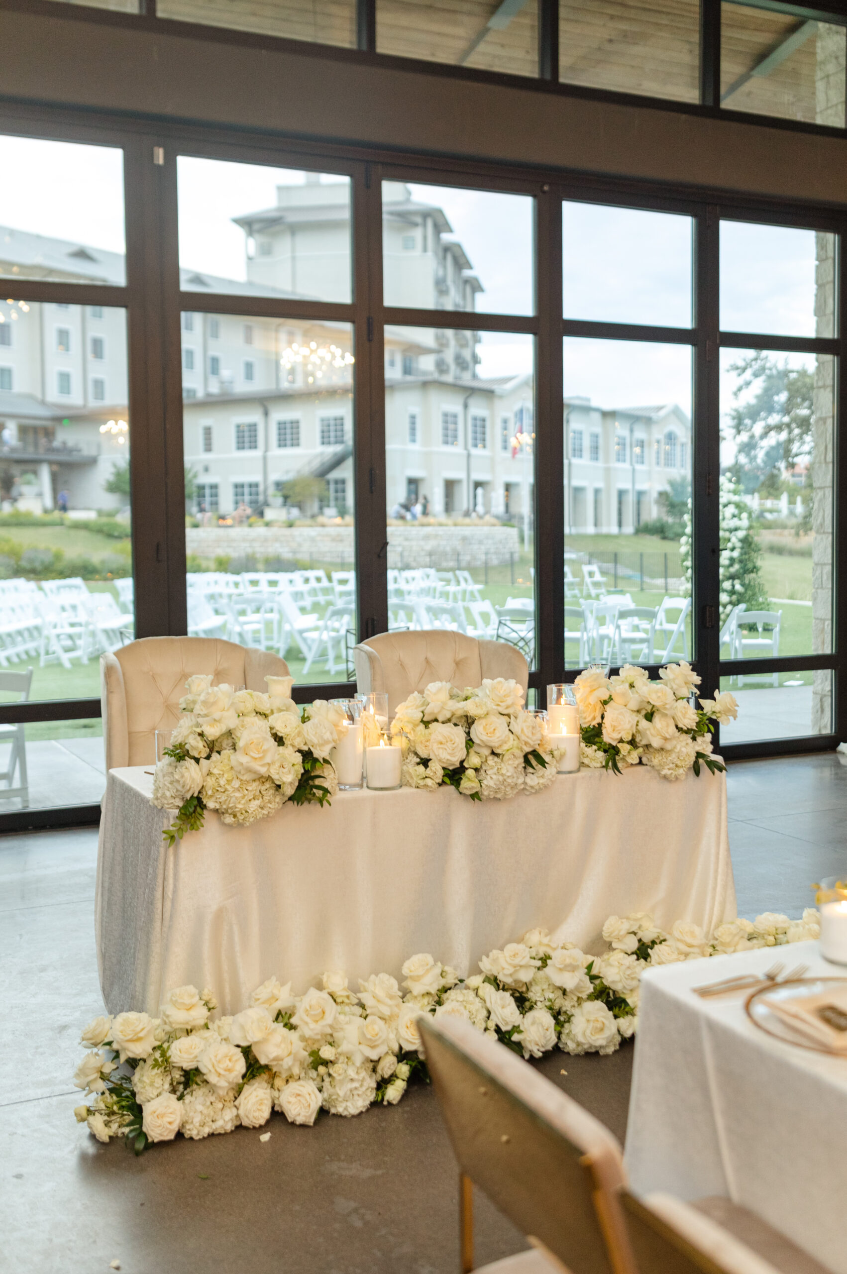 Bride and groom's sweetheart table at wedding reception