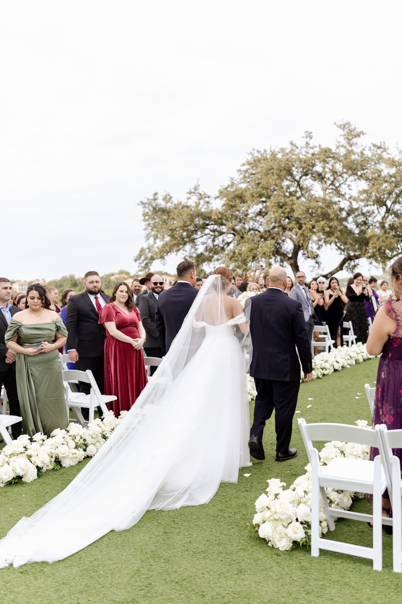 Bride walking down the aisle at outdoor wedding