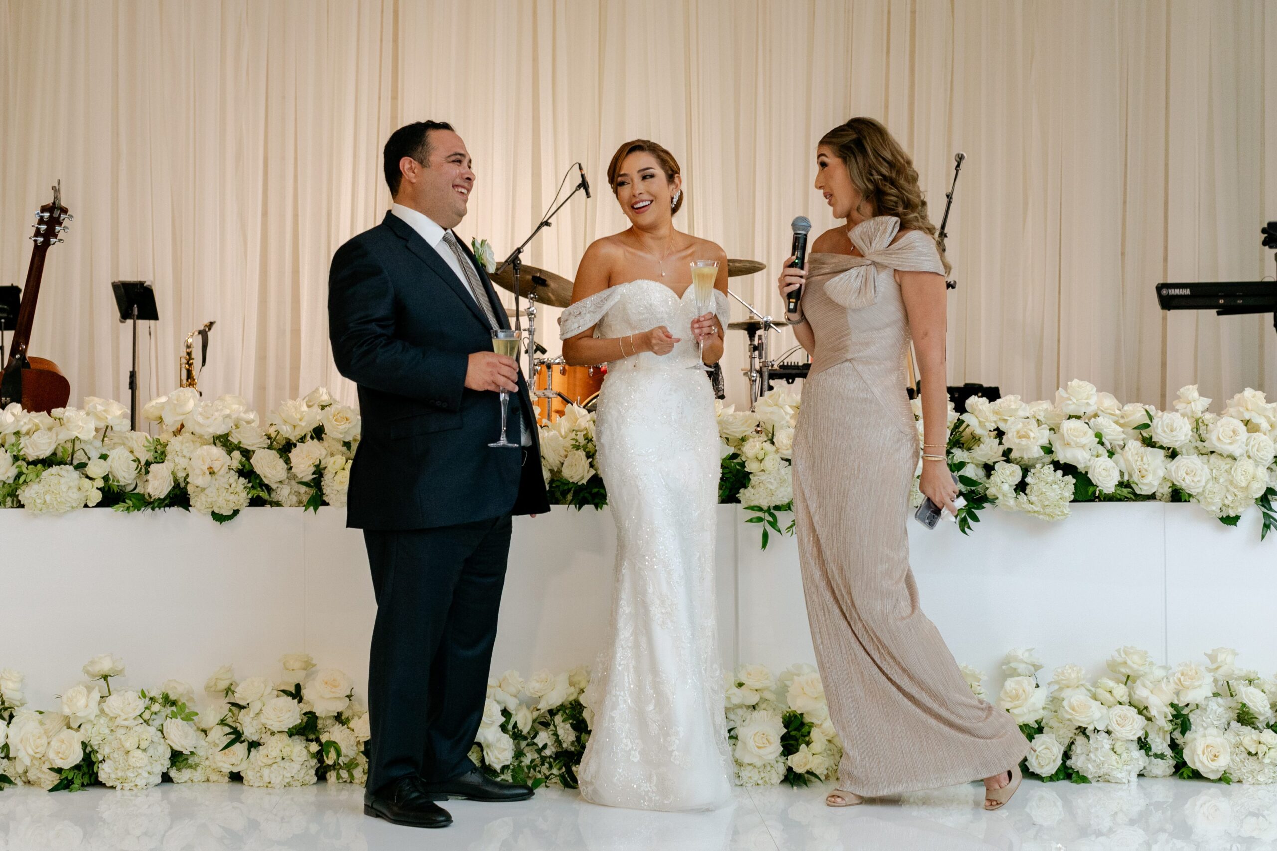 Maid of honor toasting bride and groom at wedding