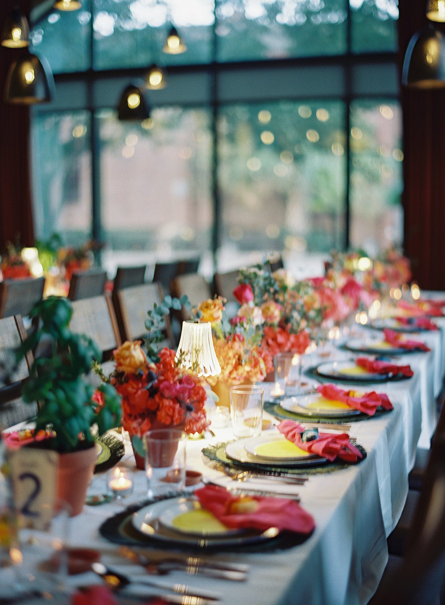 Colorful place settings at Houston rehearsal dinner