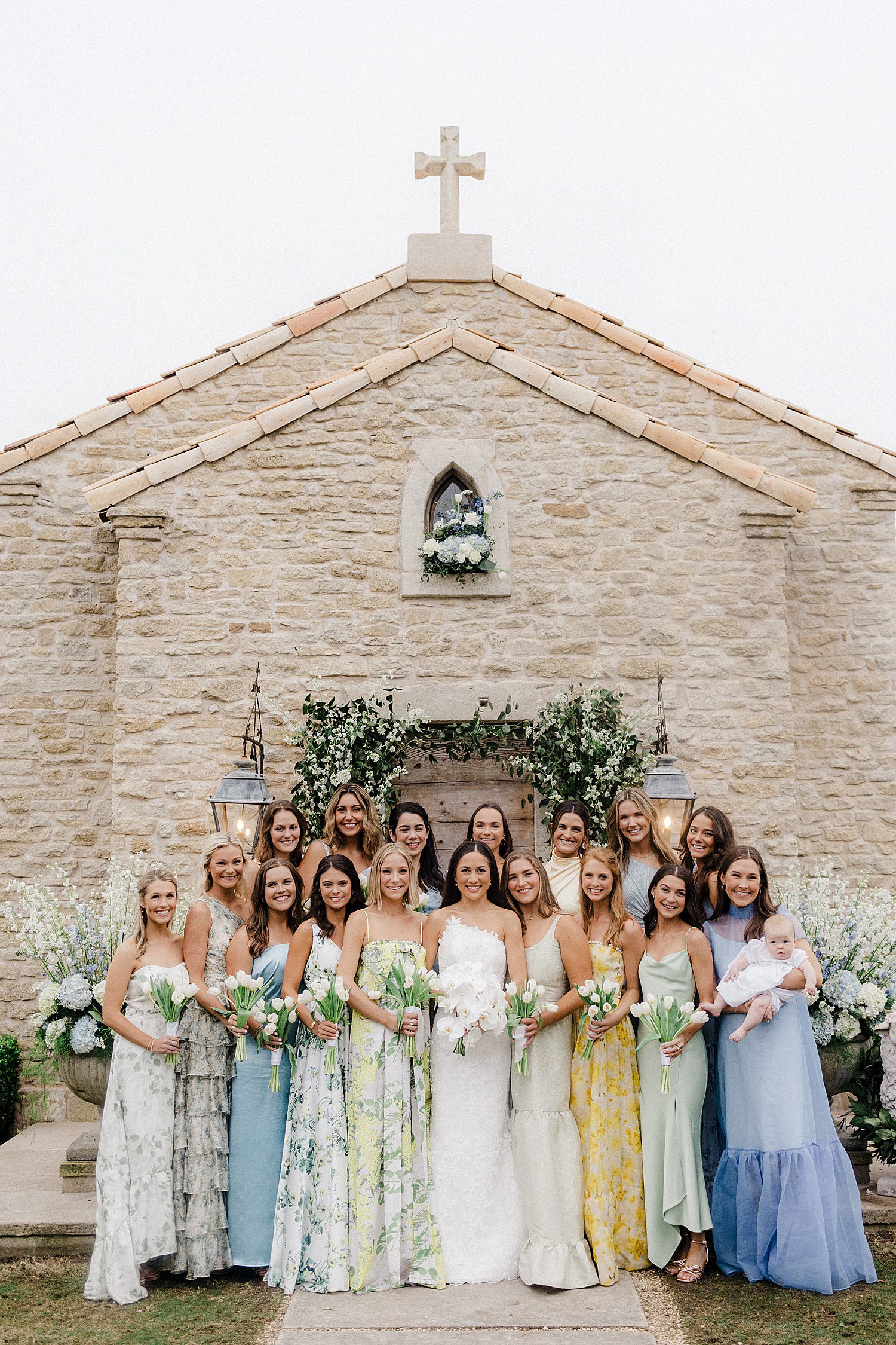 Bride & bridesmaids in front of chapel