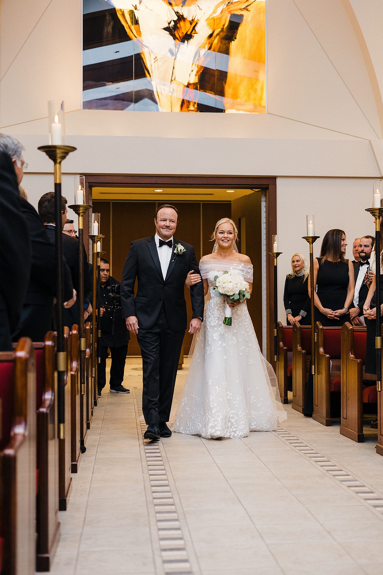 Bride walking down the aisle with her dad