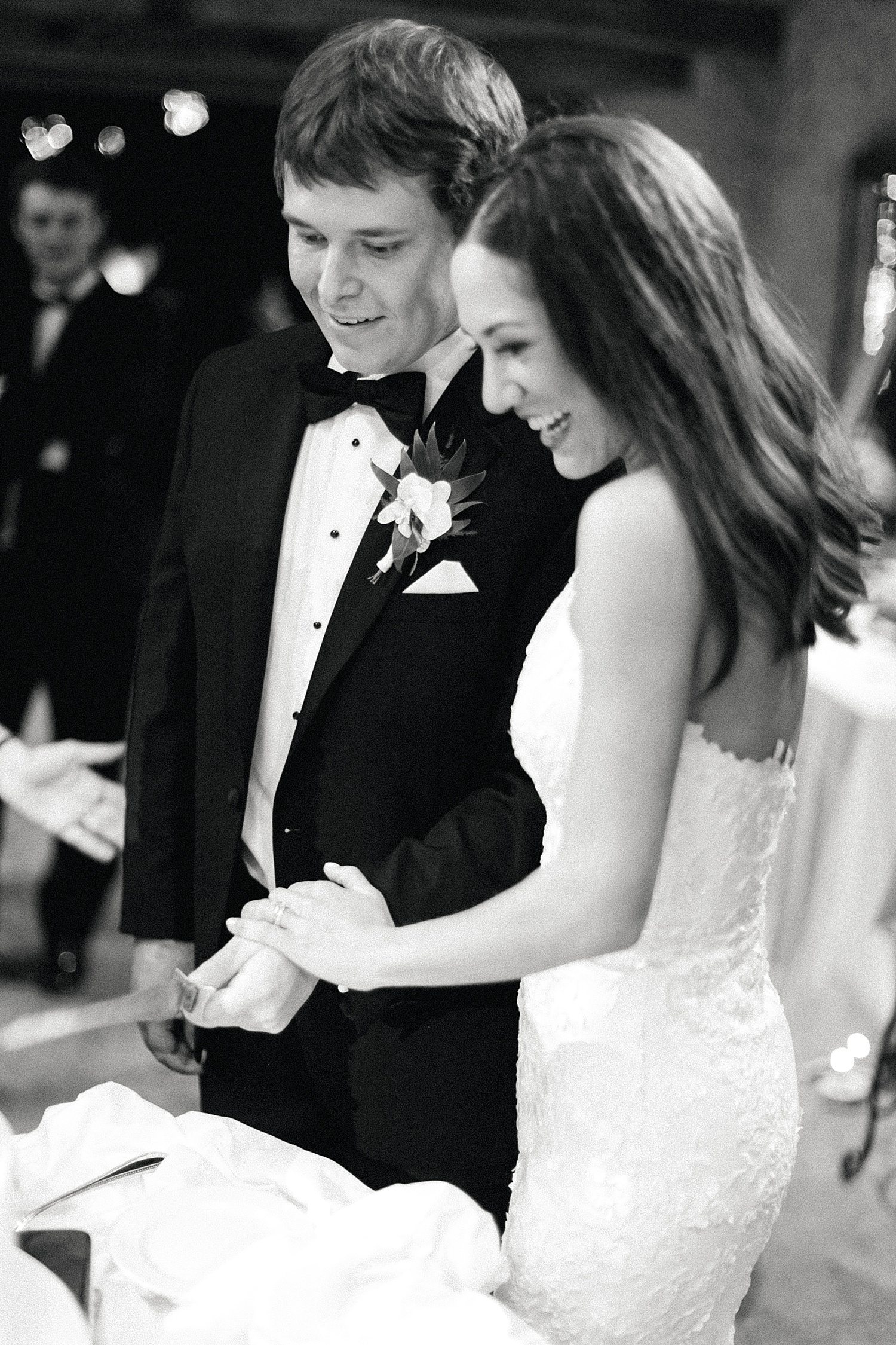 Couple cutting cake at their wedding