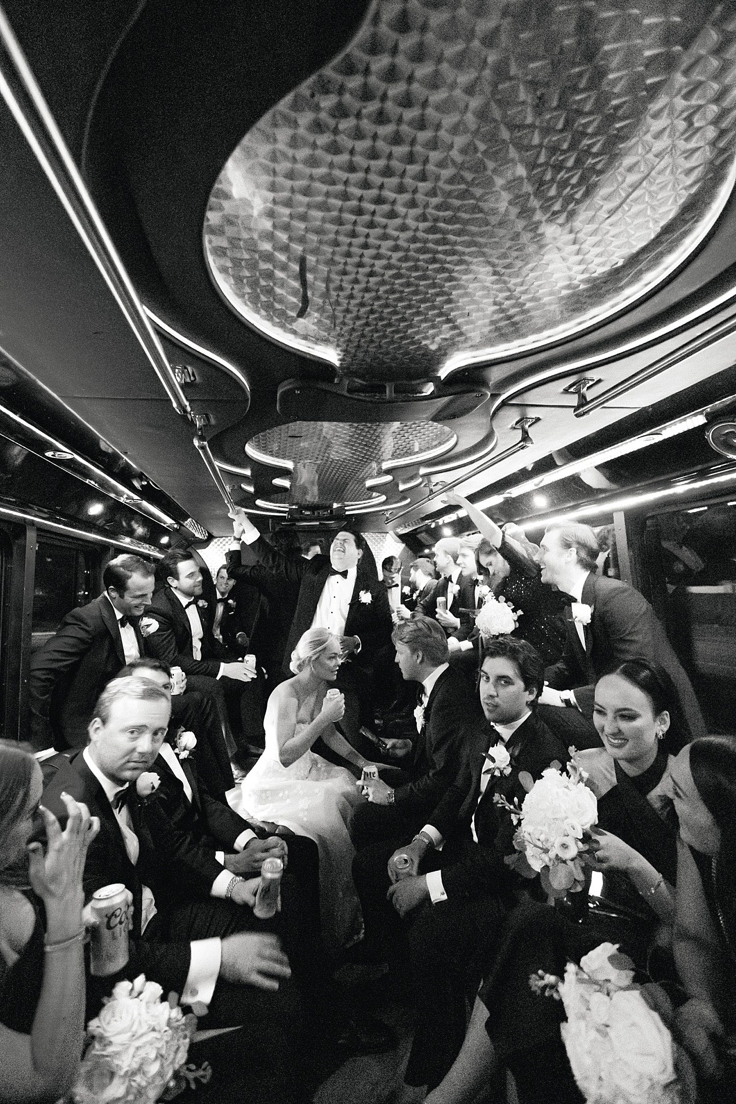 Wedding party on bus after ceremony