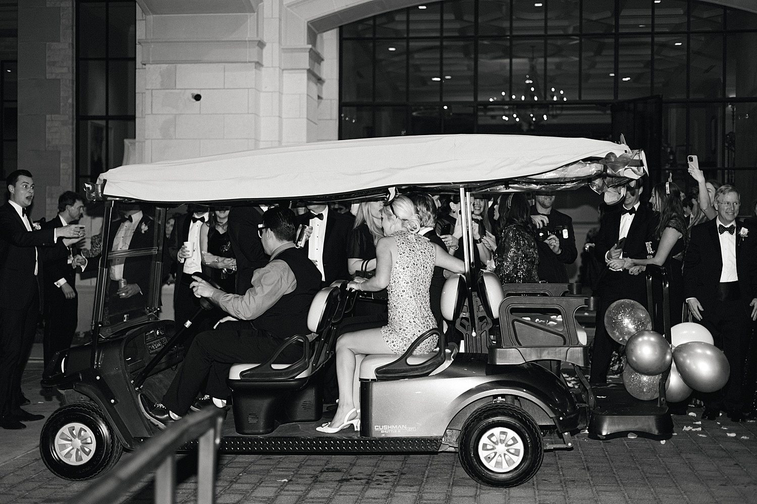 Just married couple leaving on golf cart