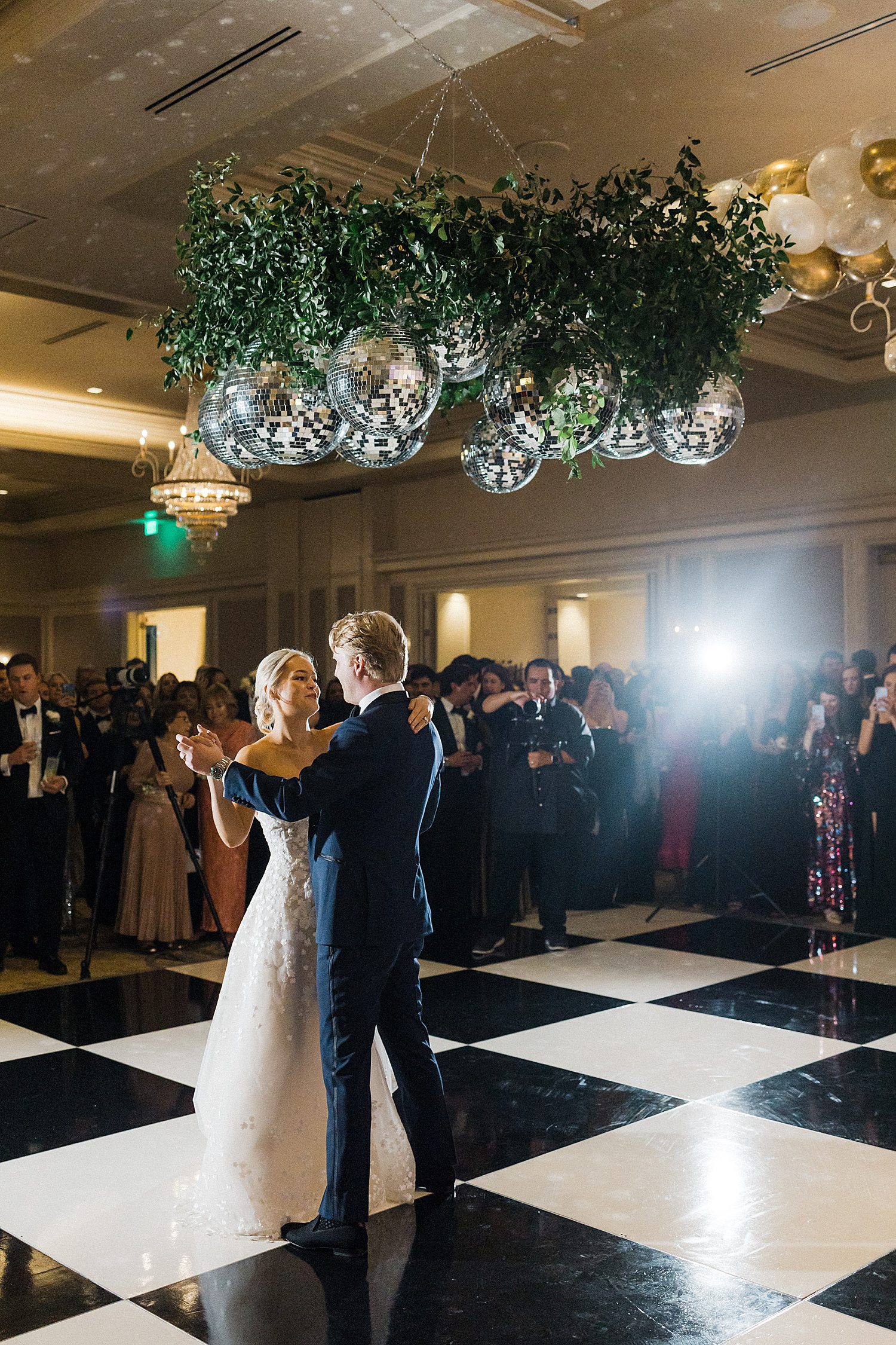 Couple's first married dance under disco balls