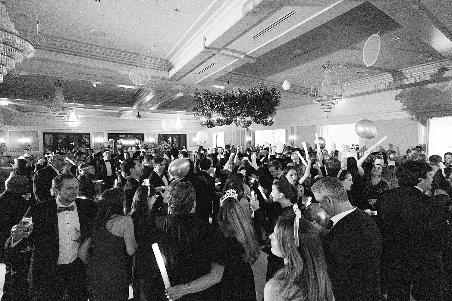 Crowd dancing at New Year's Eve wedding at midnight