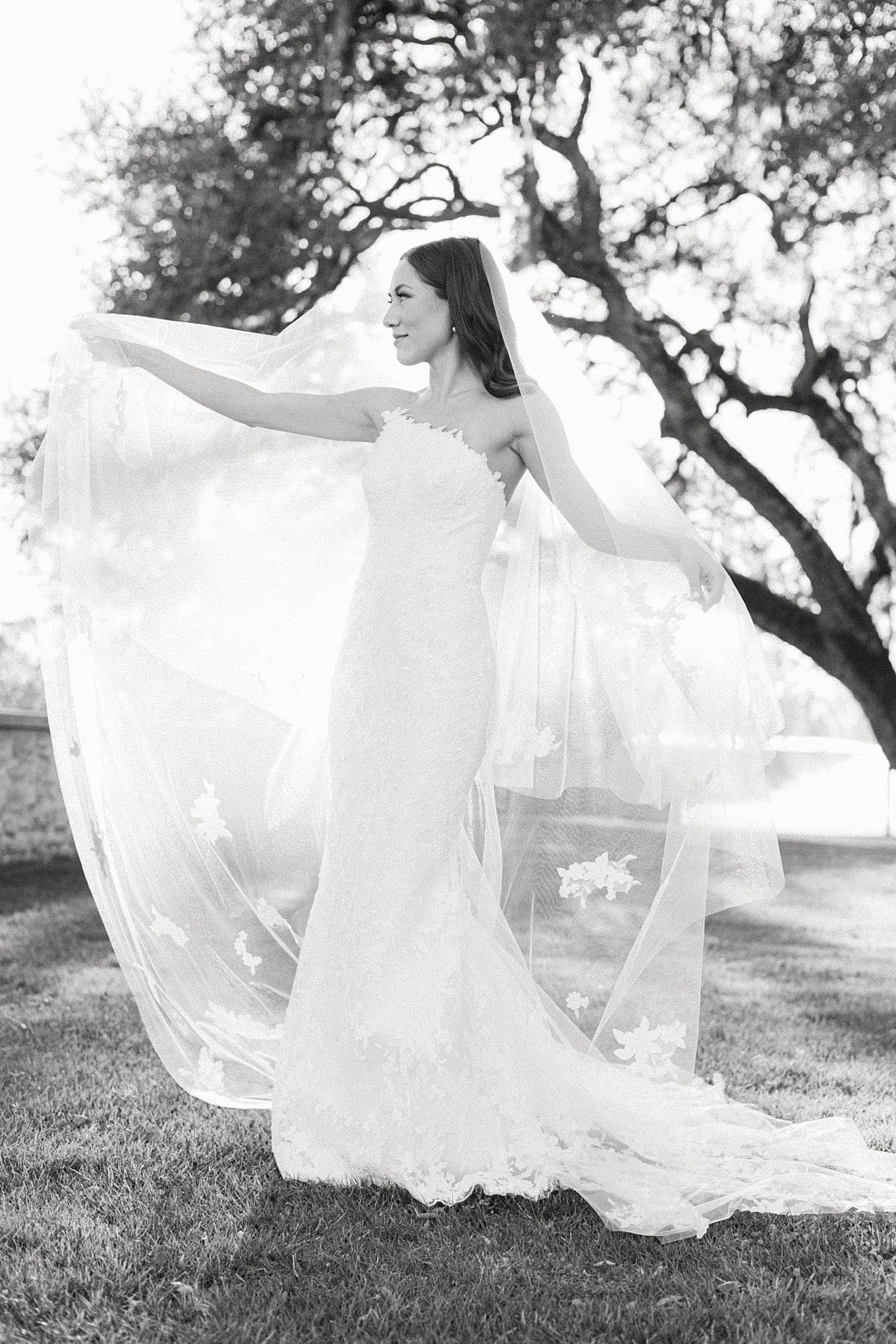 Bride swirling veil around her body