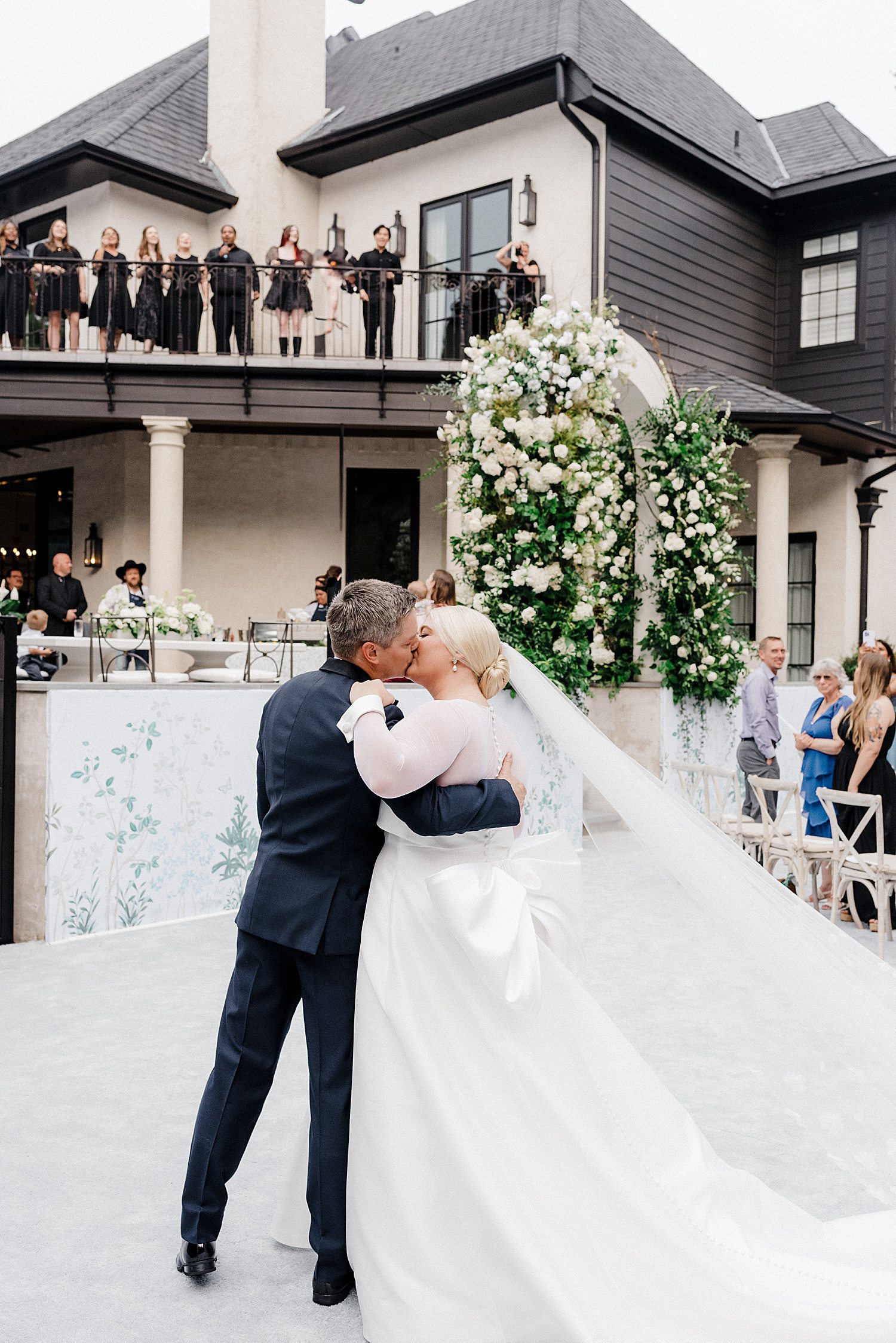 Newly married couple kissing at wedding in Dallas